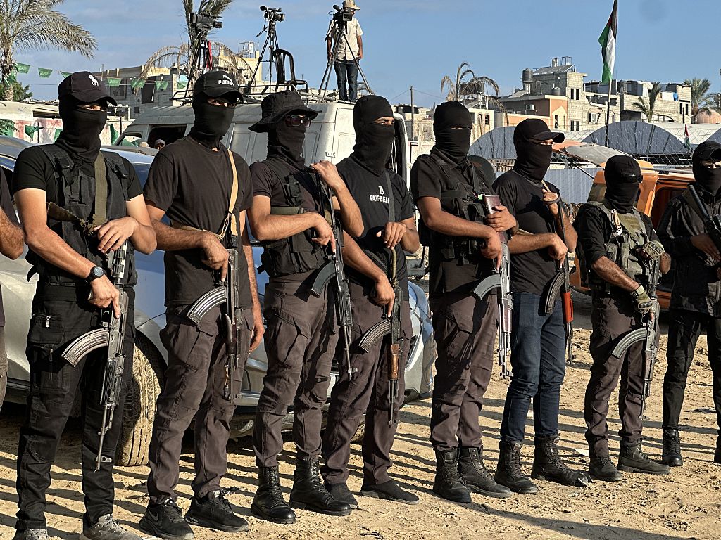 Hamas deploys fighters as hostages released, in show of strength