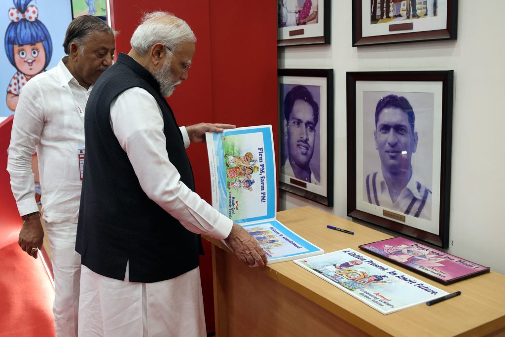 Ahmedabad: Prime Minister Narendra Modi inspects an exhibition by Amul