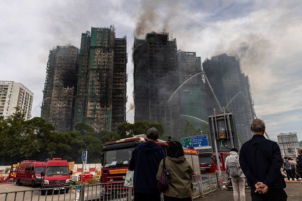 Hong Kong mourns victims of blaze that killed 128 and counting