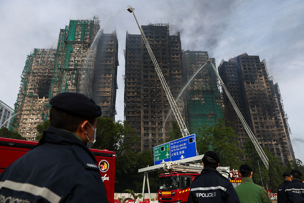 Hong Kong police arrest construction firm bosses over fire; death toll hits 83 with 300 missing
