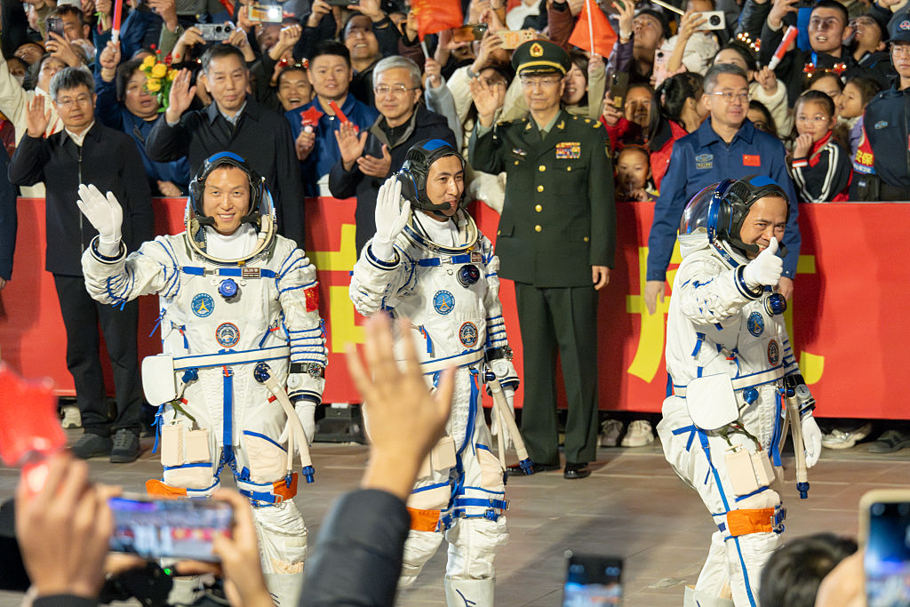 Chinese astronauts return to Earth after vessel damaged by space debris