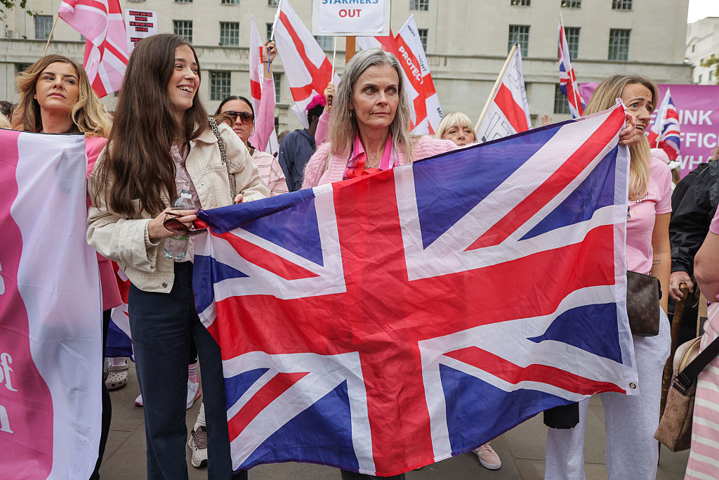 Britain to make refugee status temporary under asylum overhaul