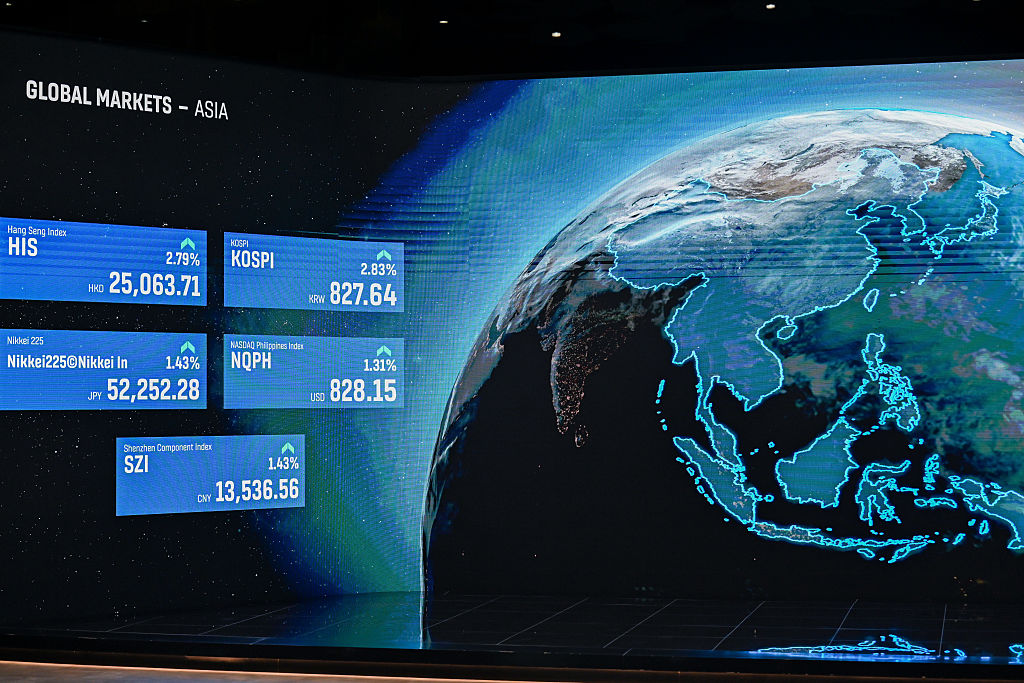 Global shares surge, oil slides in Asia on Gulf deal