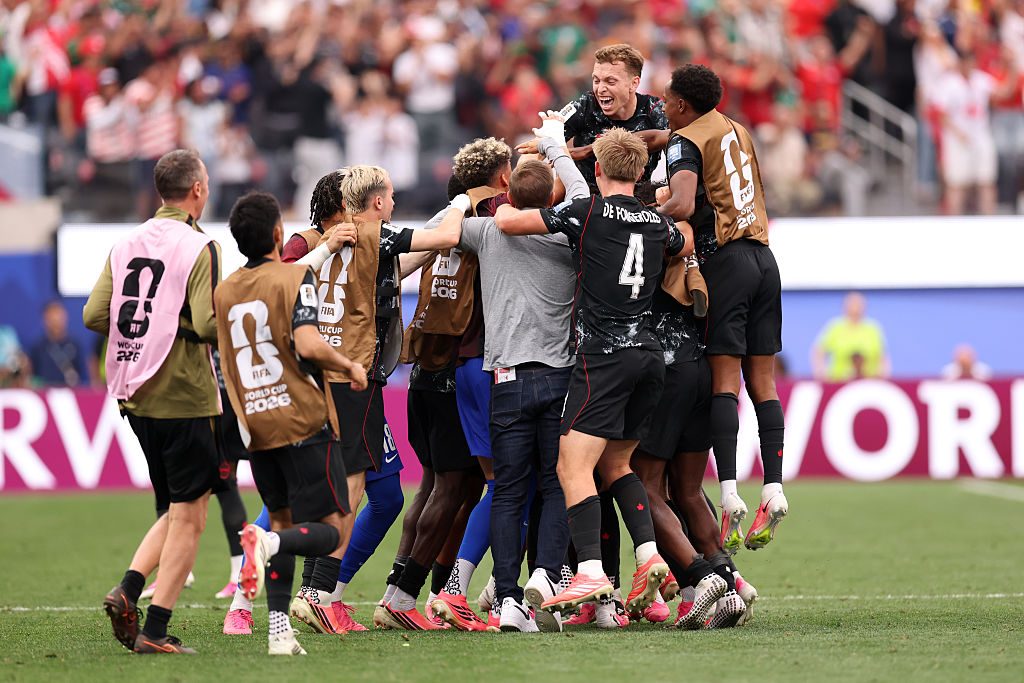 Canada score late winner to advance to last 16 at World Cup