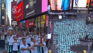 International Yoga Day dawns on Times Square with people reflecting universality with all nations and ethnicities