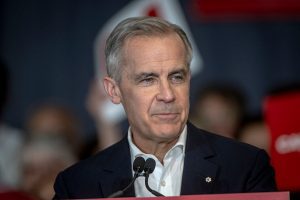 Carney defends free trade after Trump imposes 50% tariff on select Canadian goods