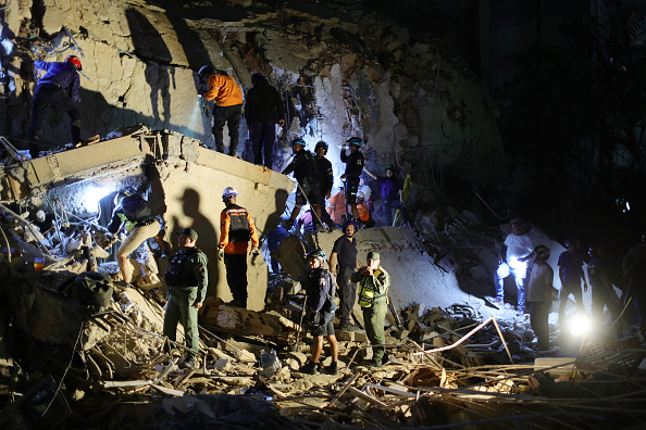 Between silence and shouts, rescuers dig for Venezuela twin quake survivors