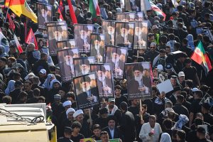 Thousands march as Khamenei's funeral procession crosses into Iraq