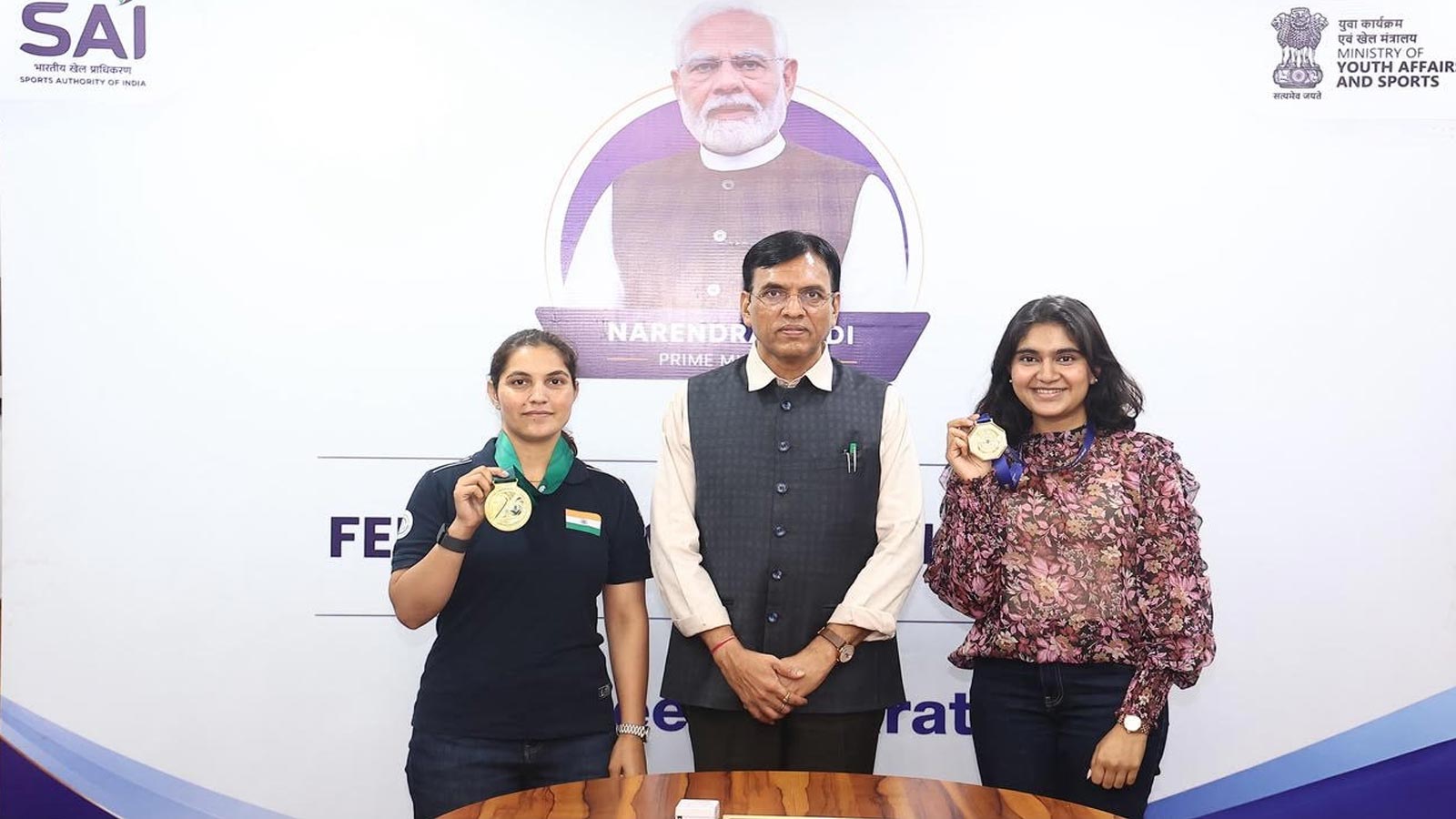 Mansukh Mandaviya felicitates ISSF World Cup champions Esha Singh and Neeru Dhanda