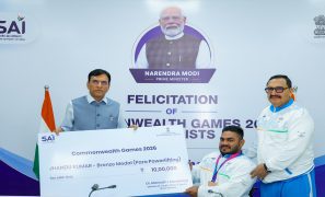 Sports Minister Mansukh Mandaviya felicitates Commonwealth Games Bronze medallist Jhandu Kumar with Rs 10 lakh award