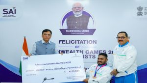 Sports Minister Mansukh Mandaviya felicitates Commonwealth Games Bronze medallist Jhandu Kumar with Rs 10 lakh award