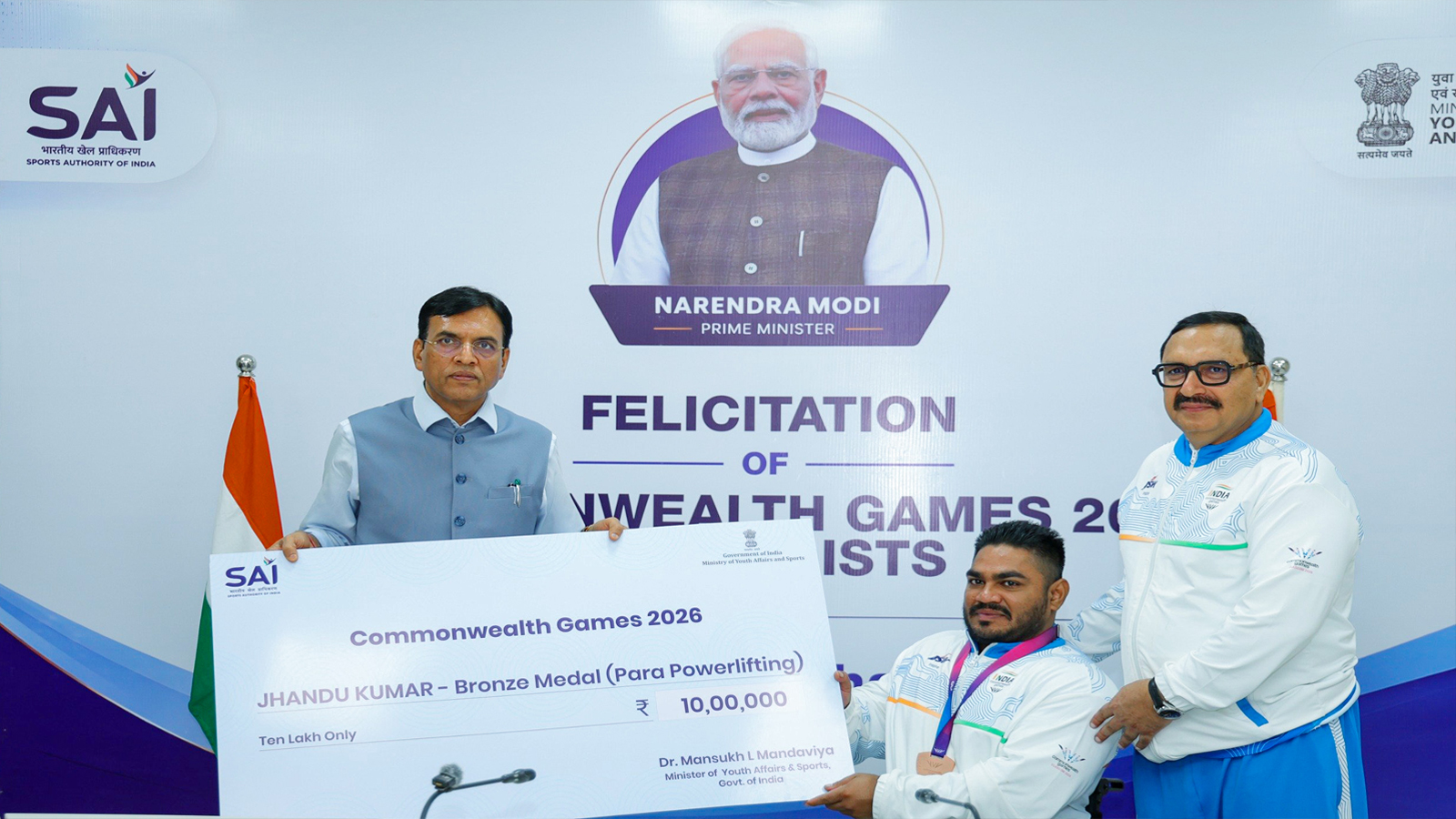 Sports Minister Mansukh Mandaviya felicitates Commonwealth Games Bronze medallist Jhandu Kumar with Rs 10 lakh award