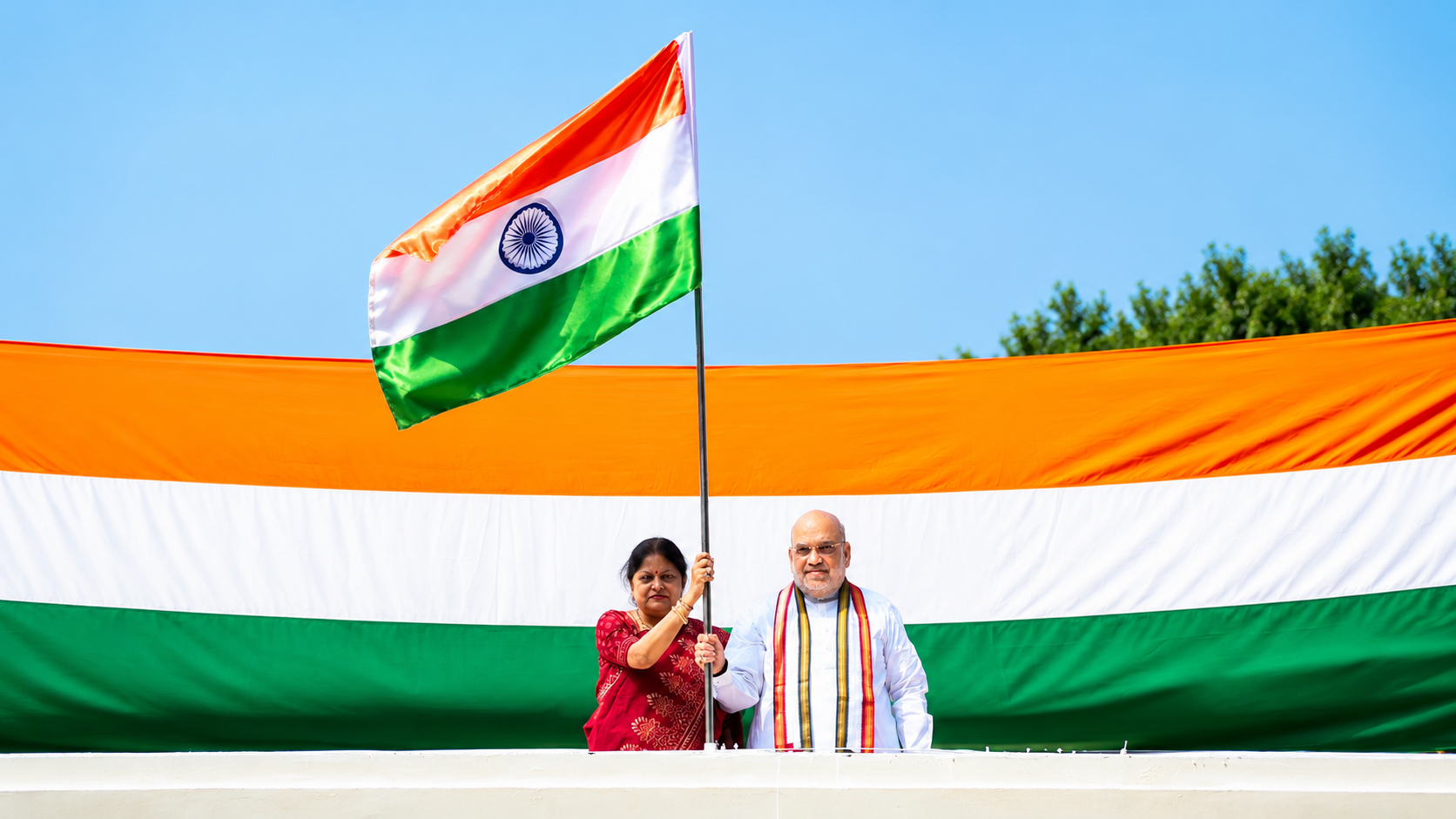 Union Home Minister Amit Shah hoists Tiranga at residence under Har Ghar Tiranga campaign