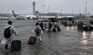 Japan's record rains strand thousands at Narita airport; kill eight