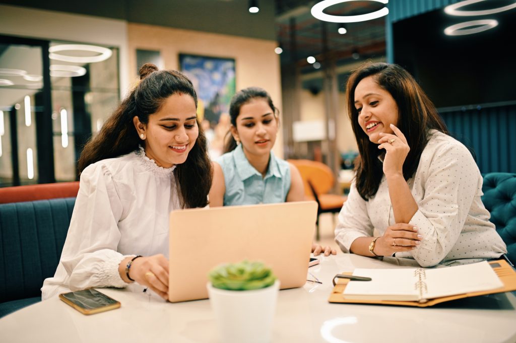 Group of women discussing in a co-working office