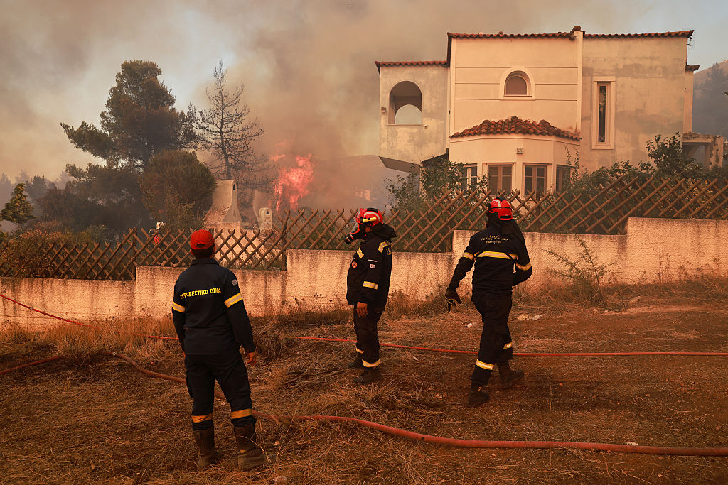 Two die as firefighting helicopters collide in Greece, French blaze changes course