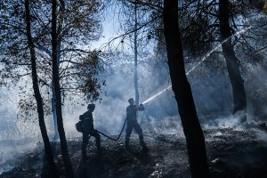 Wildfires near Spokane destroy more than 700 buildings, force 64,000 to flee