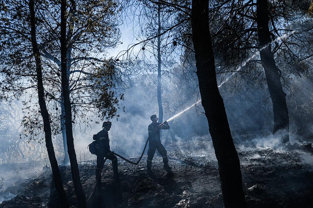 Wildfires near Spokane destroy more than 700 buildings, force 64,000 to flee