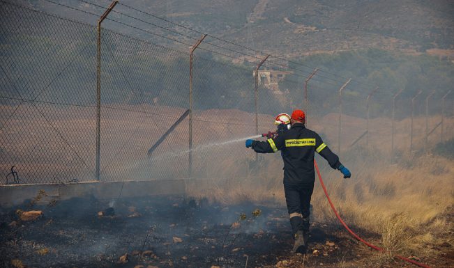 Wildfires ease in Greece as people return to gutted homes