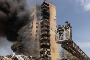 Russian strikes in Kyiv region kill 14, damage warehouses, responders say