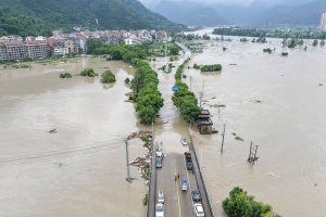 Typhoon Dolphin's vast storm system pushes inland, threatens central China