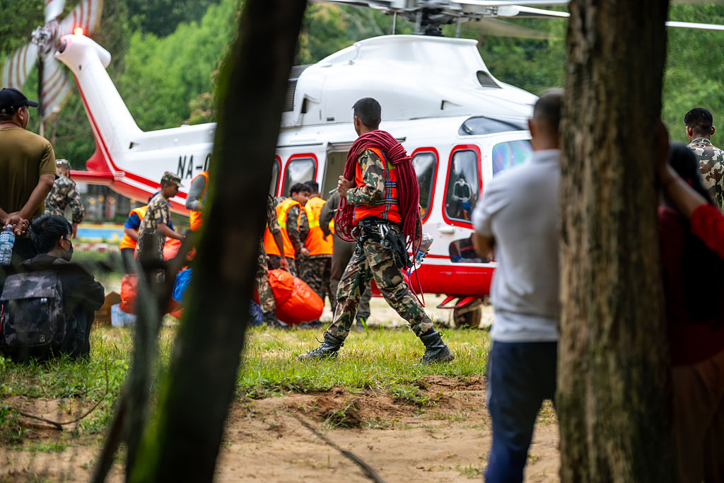 Security forces lead search and rescue operation following deadly flash flood in Nepal