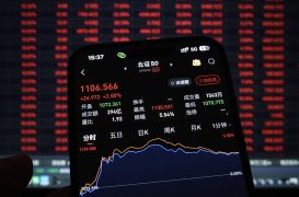 Asia stocks waver as yen surges, Iran warns of retaliation