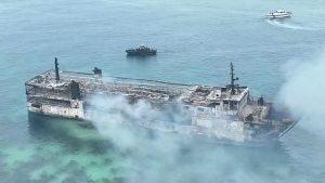 Philippine firefighters enter charred ferry as search continues for dozens missing