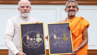 PM Modi unveils logo for birth centenary celebrations of Sri Vishwesha Tirtha Swami