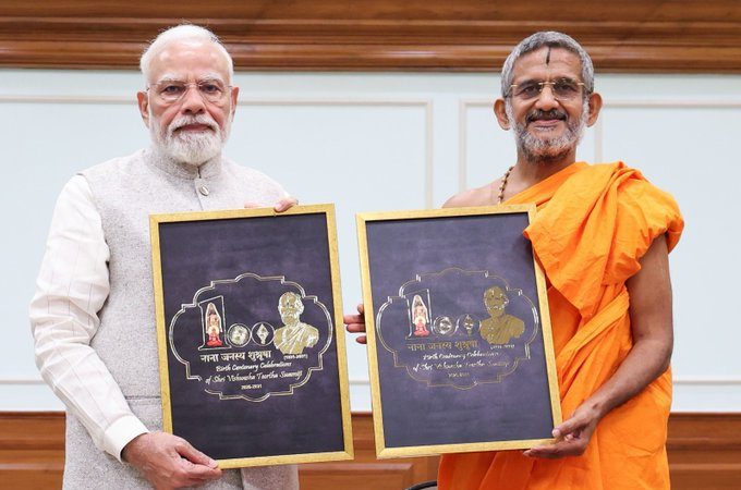 PM Modi unveils logo for birth centenary celebrations of Sri Vishwesha Tirtha Swami